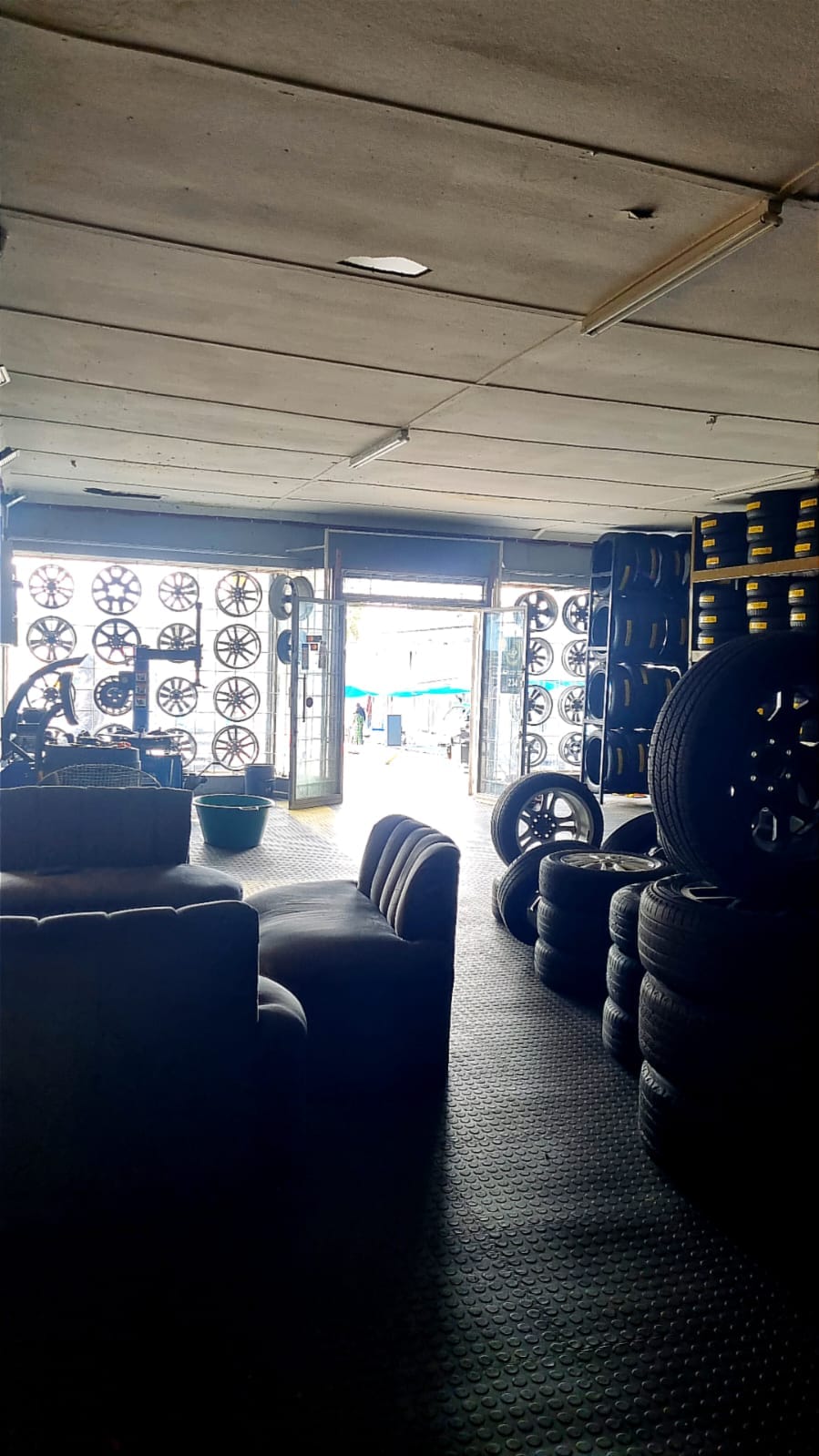 Mag wheels displayed on the wall inside the Bong's Tyre Centre showroom