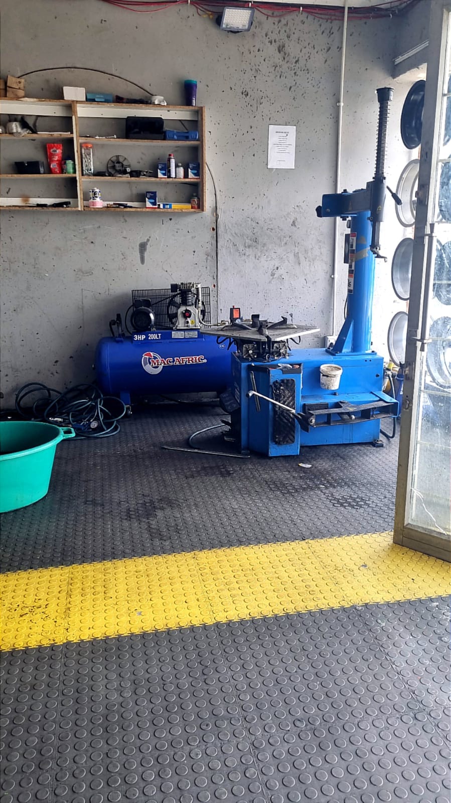 The tyre-changing and balancing machine in the fitment bay at Bong's Tyre Centre